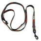 Plaid patterned dog leash on a white background