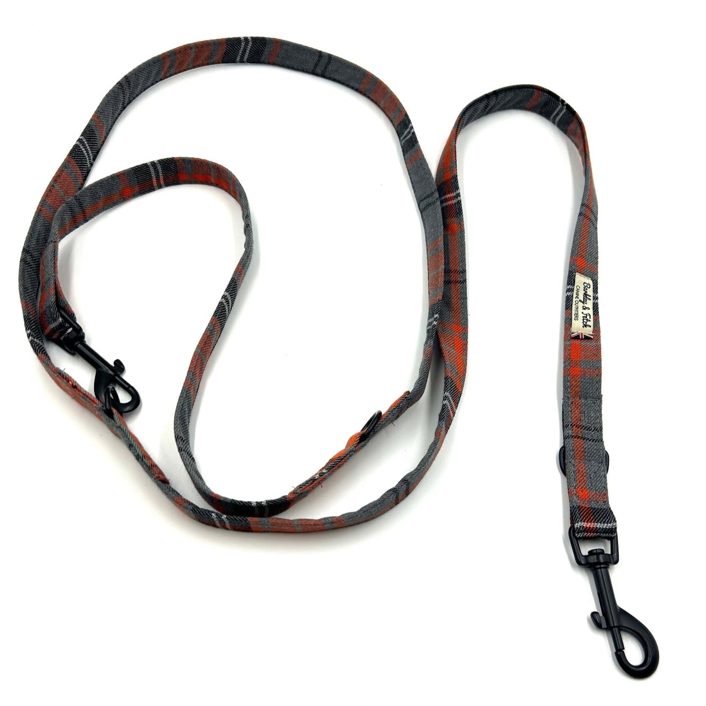 Plaid patterned dog leash on a white background