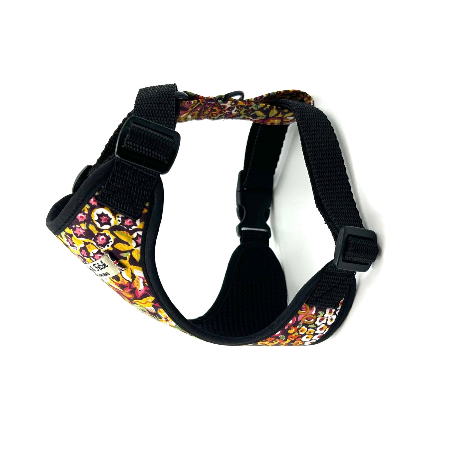 Floral-patterned dog harness on a white background