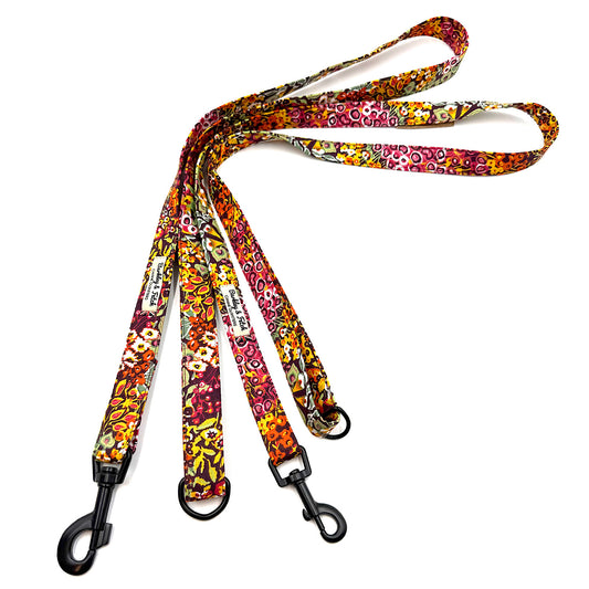 Colorful floral-patterned dog leash on a white background