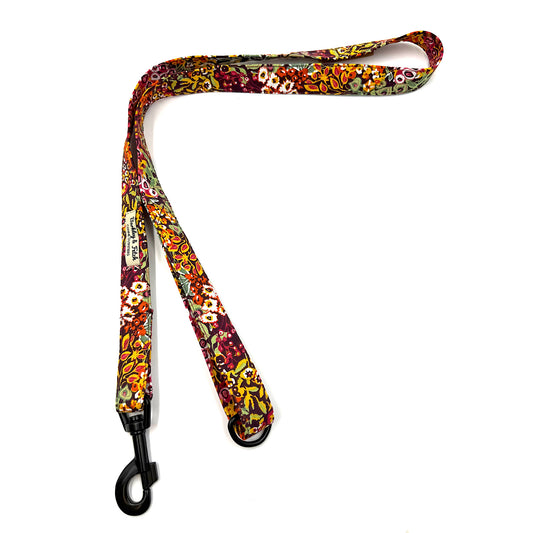Colorful floral-patterned dog leash on a white background