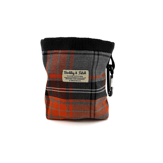 Plaid dog treat pouch with a visible brand label on a white background