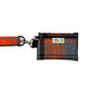 Plaid dog leash with matching pouch on a white background