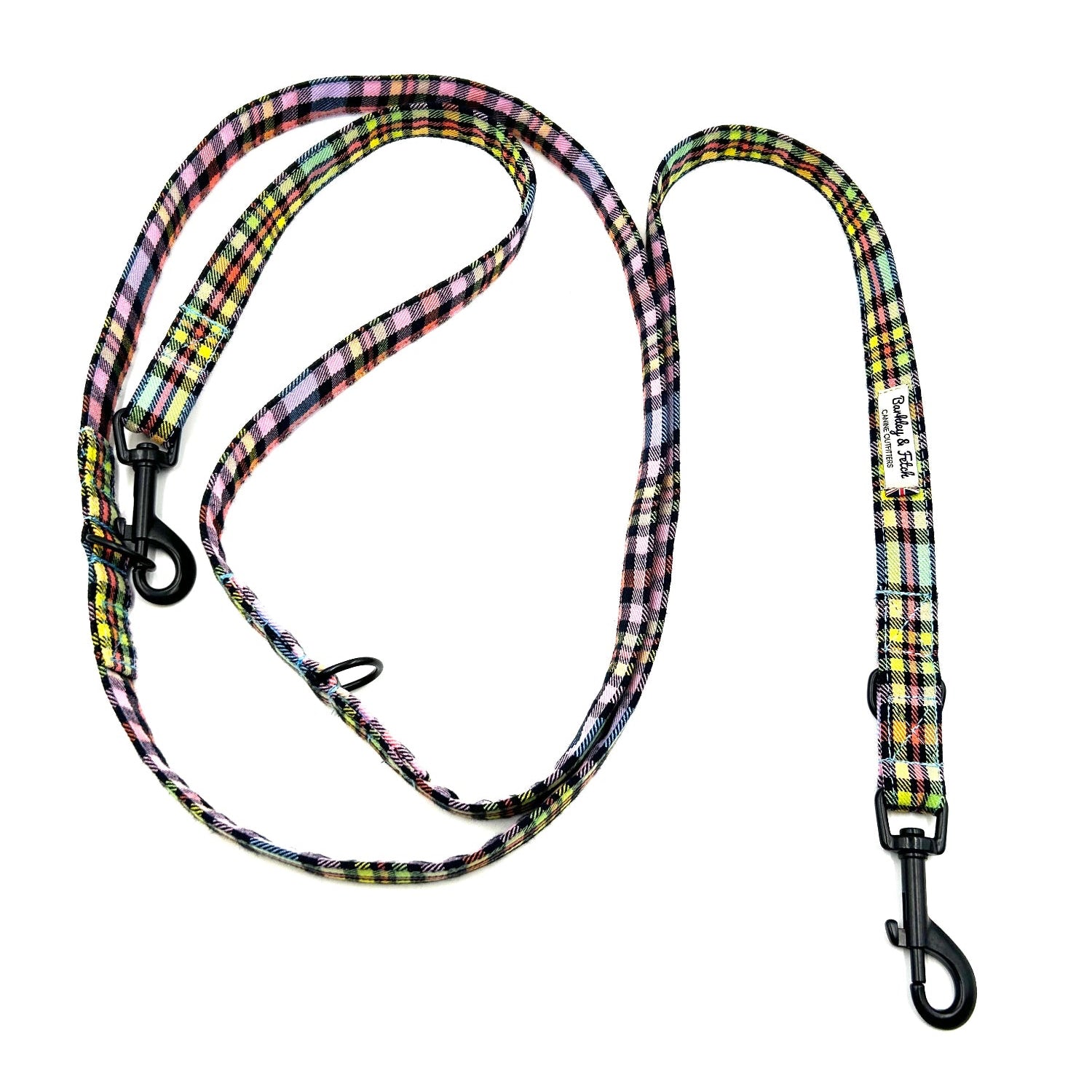 Plaid patterned dog leash on a white background
