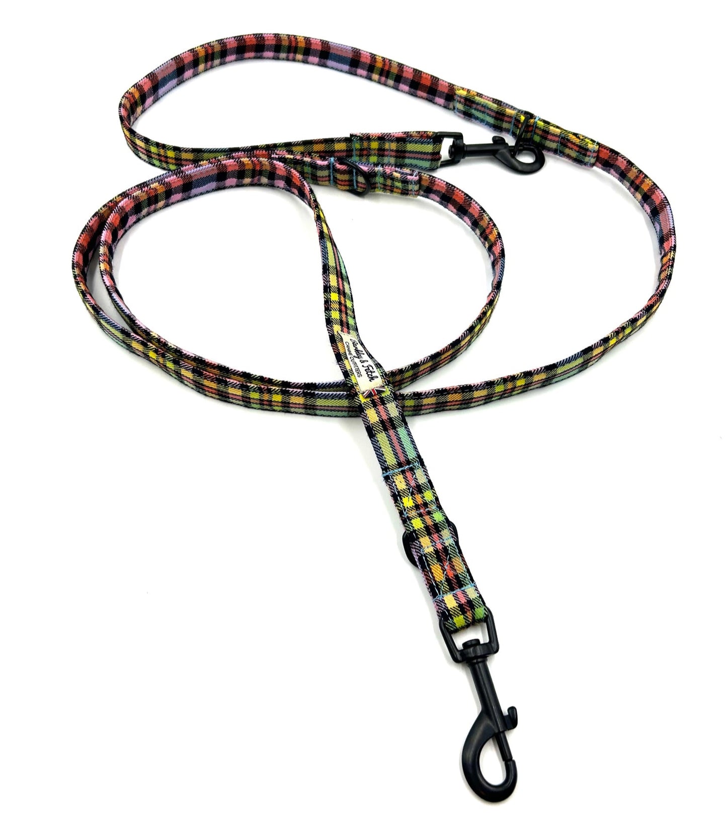 Plaid patterned dog leash on a white background