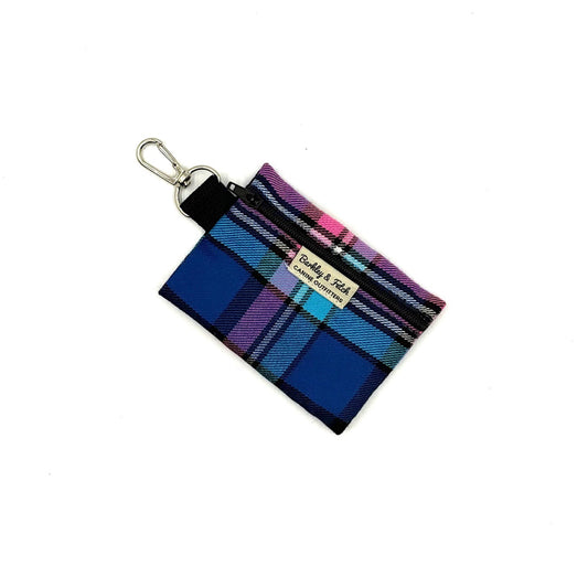 Plaid keychain pouch with a visible brand label on a white background