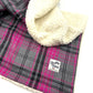 Plaid blanket with white sherpa lining and a visible brand label handmade by Barkley and Fetch of Great Britain