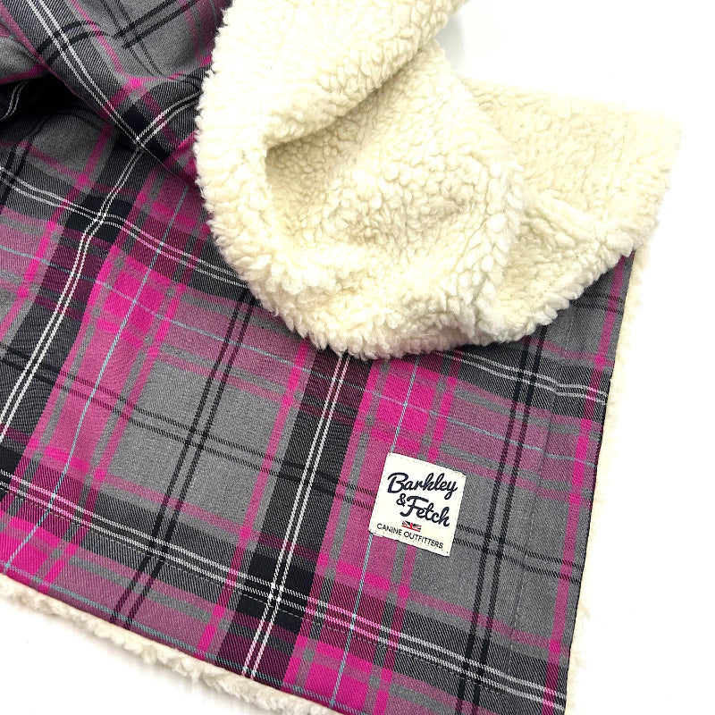 Plaid blanket with white sherpa lining and a visible brand label handmade by Barkley and Fetch of Great Britain