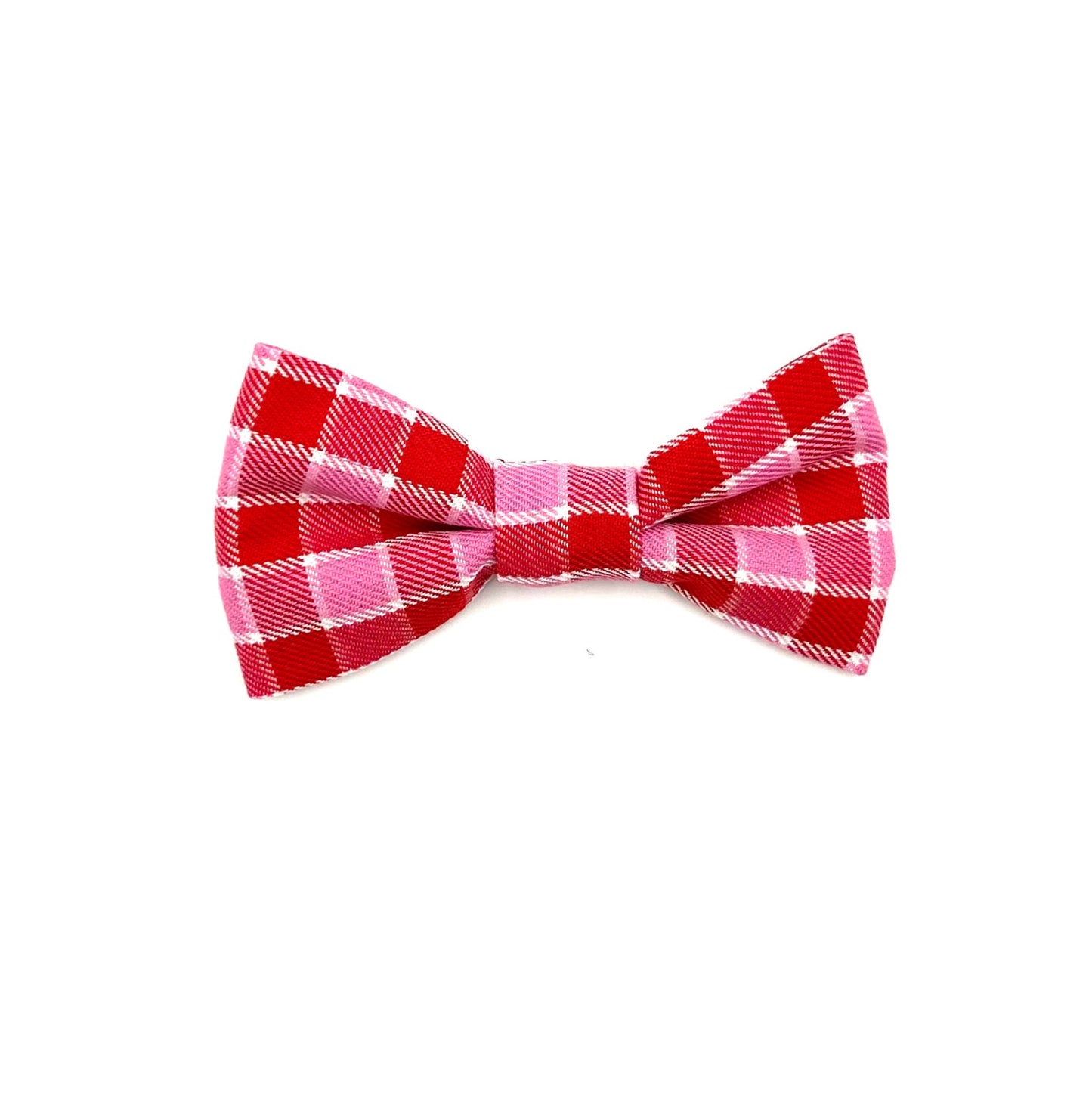A pink and red tartan check dog bowtie on a white background.