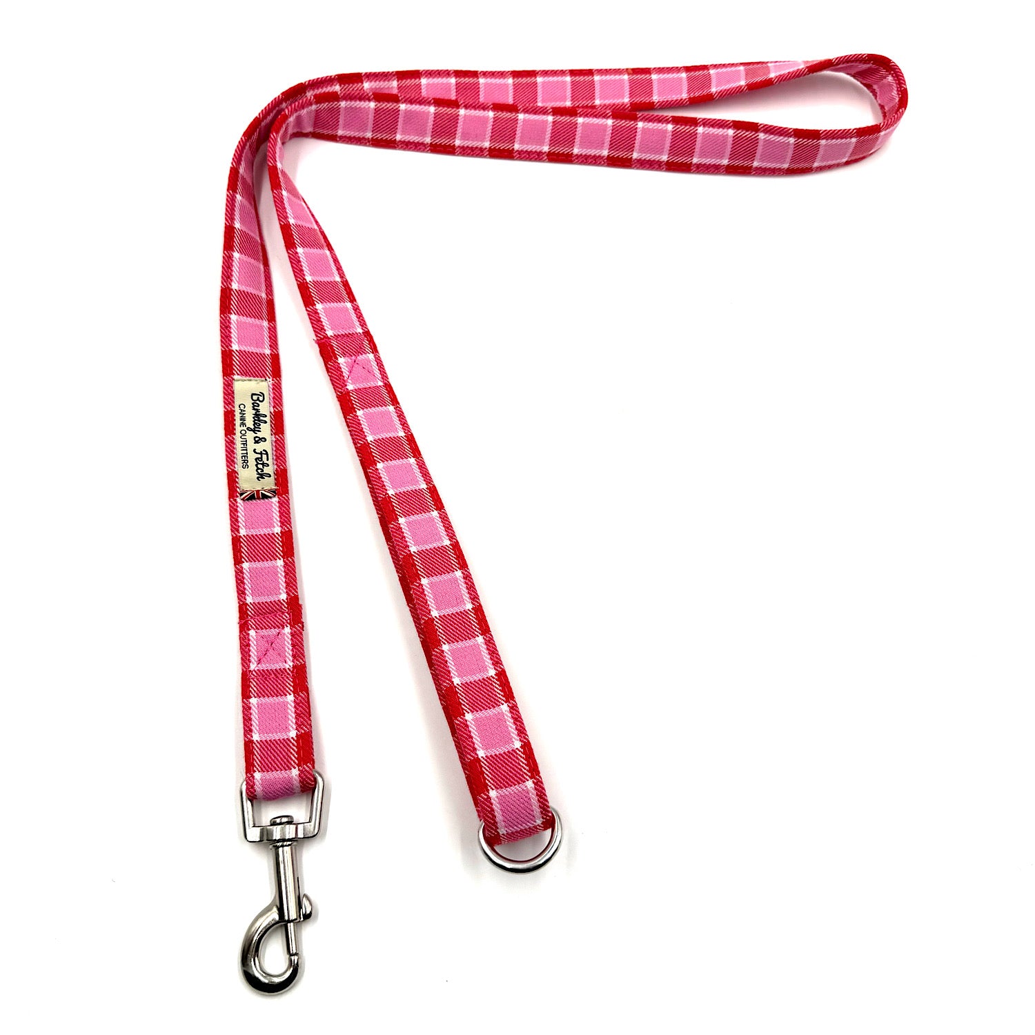 Red and pink plaid dog leash with metal clip on a white background