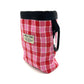 Red and pink checkered pouch with black strap on a white background