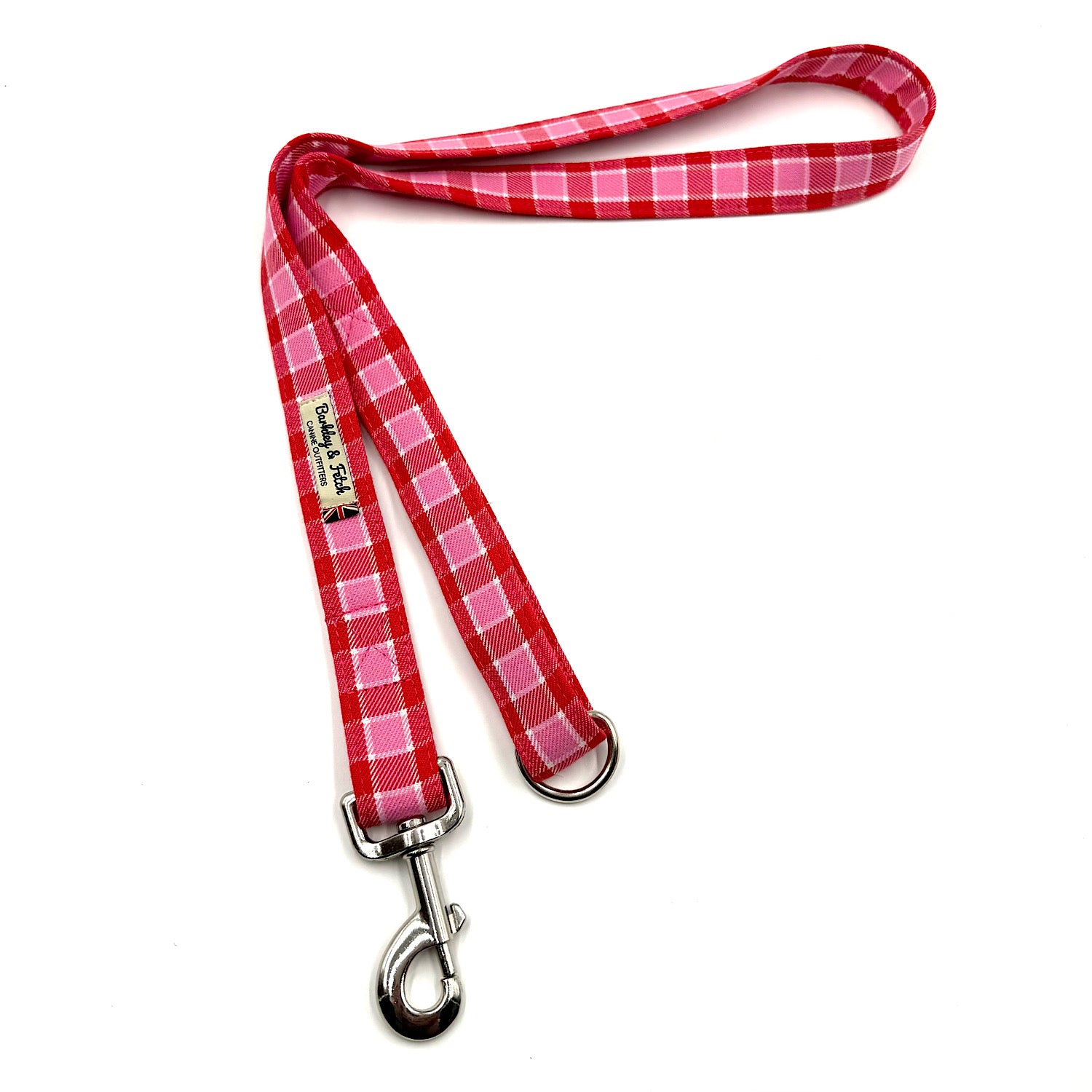 Red and white checkered dog leash with metal clip on a white background