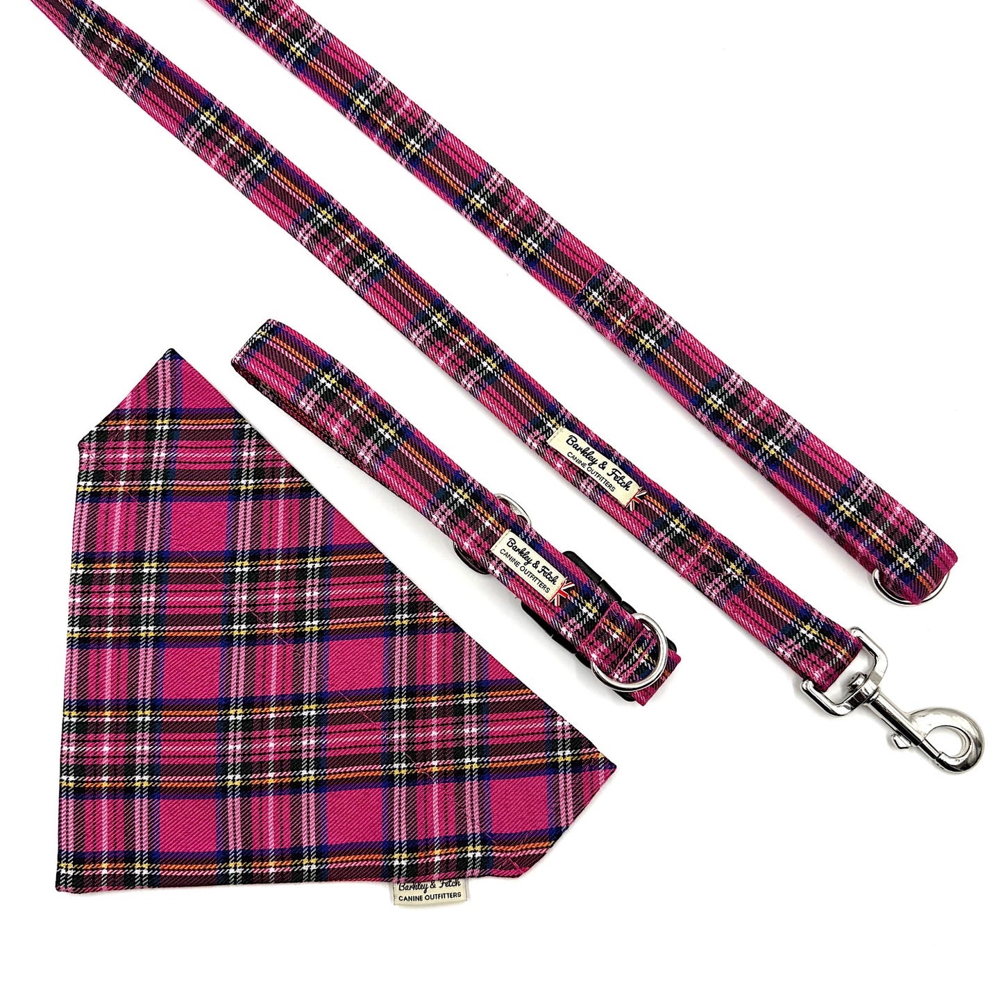 Pink plaid dog leash and bandana set on a white background