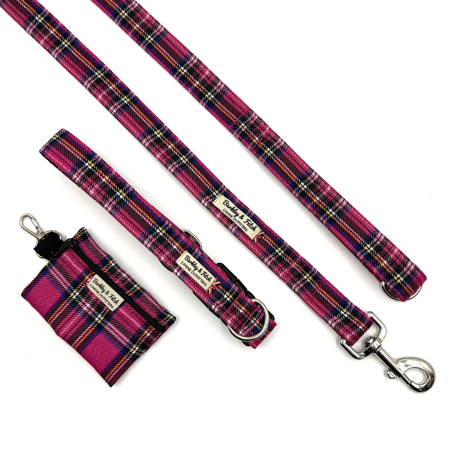 Plaid dog leash and matching pouch with a brand label on a white background