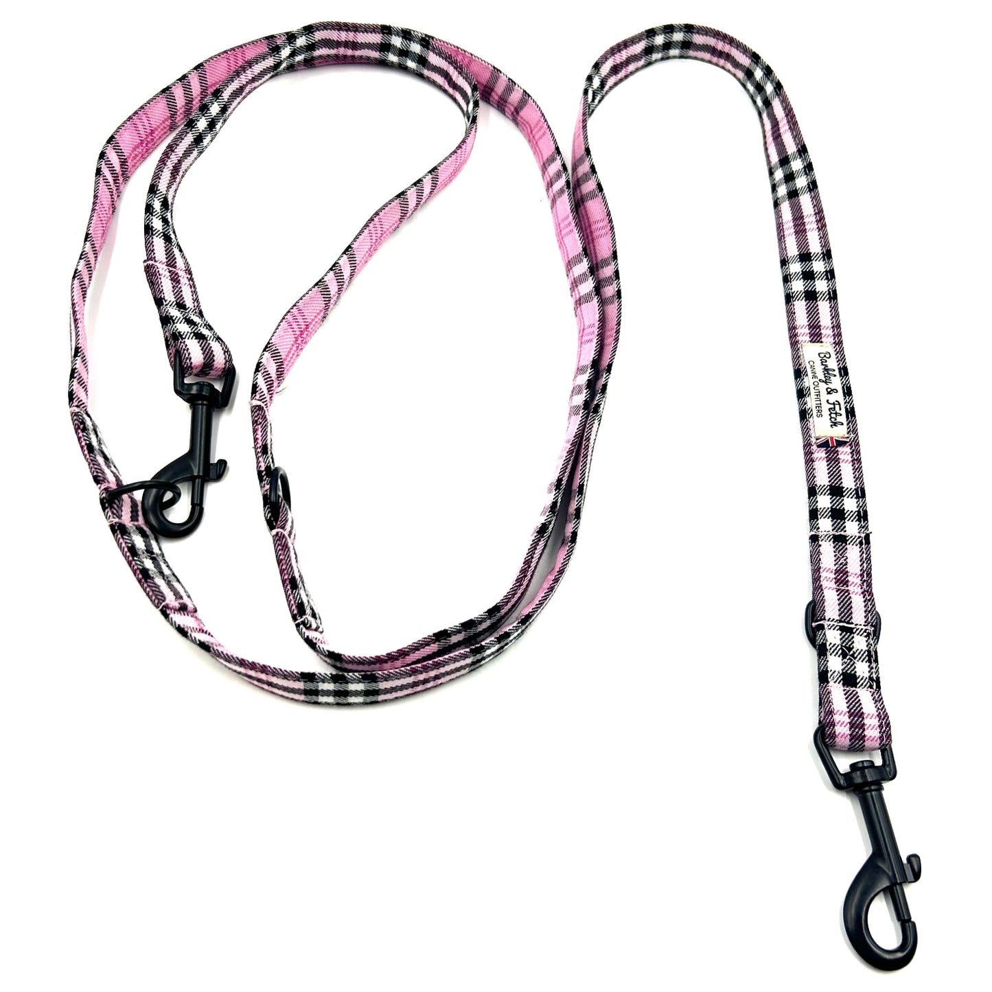 Pink and black checkered dog leash on a white background