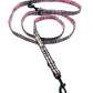 Pink and black checkered dog leash on a white background