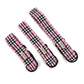 Three pink and black plaid dog collars on a white background