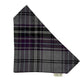 Plaid fabric triangle with visible brand label on a white background