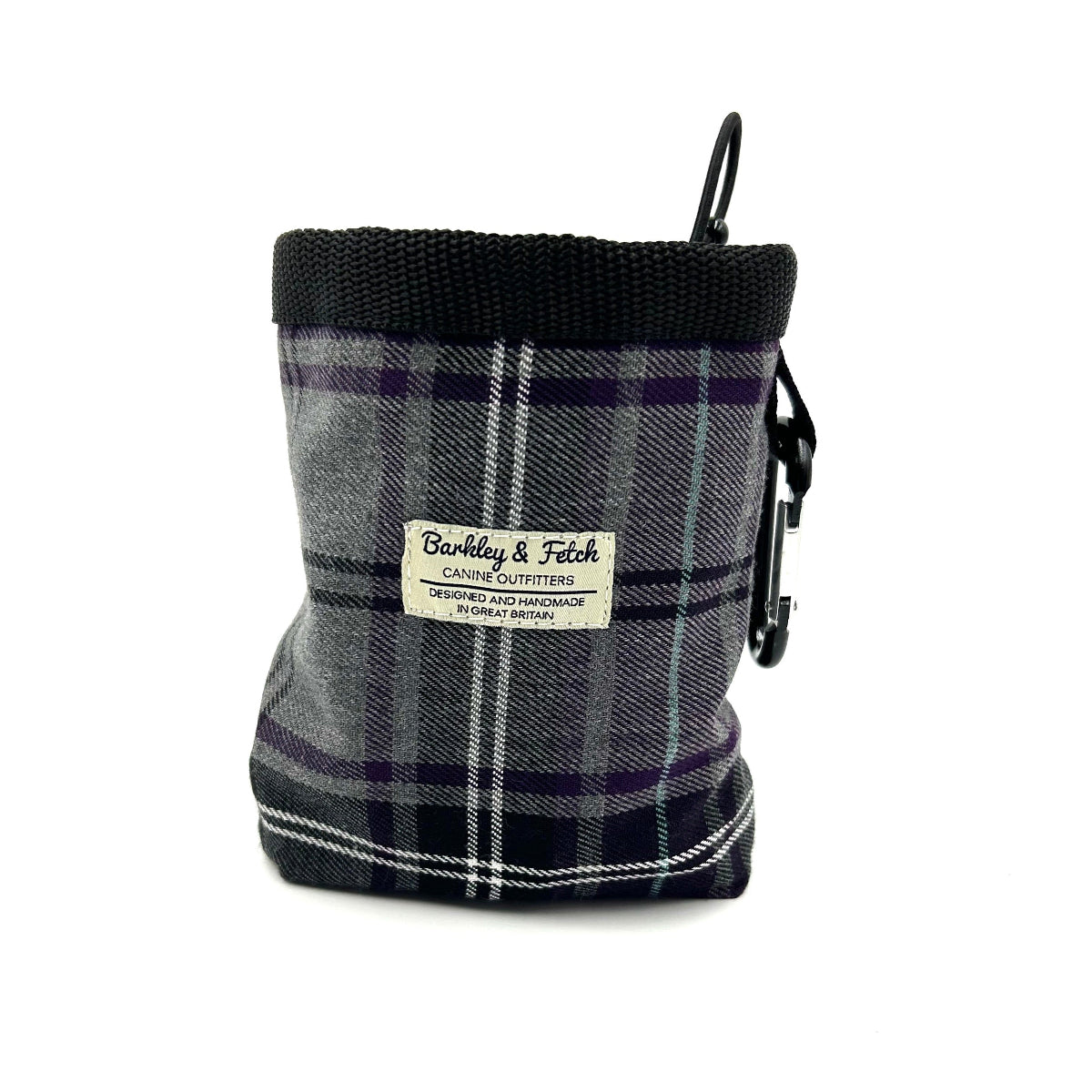 A purple and grey tartan dog treat bag with an elasticated drawcord closure and a brand label displayed on the front.