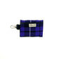 A purple tartan patterned poo bag holder with a clip attachment.