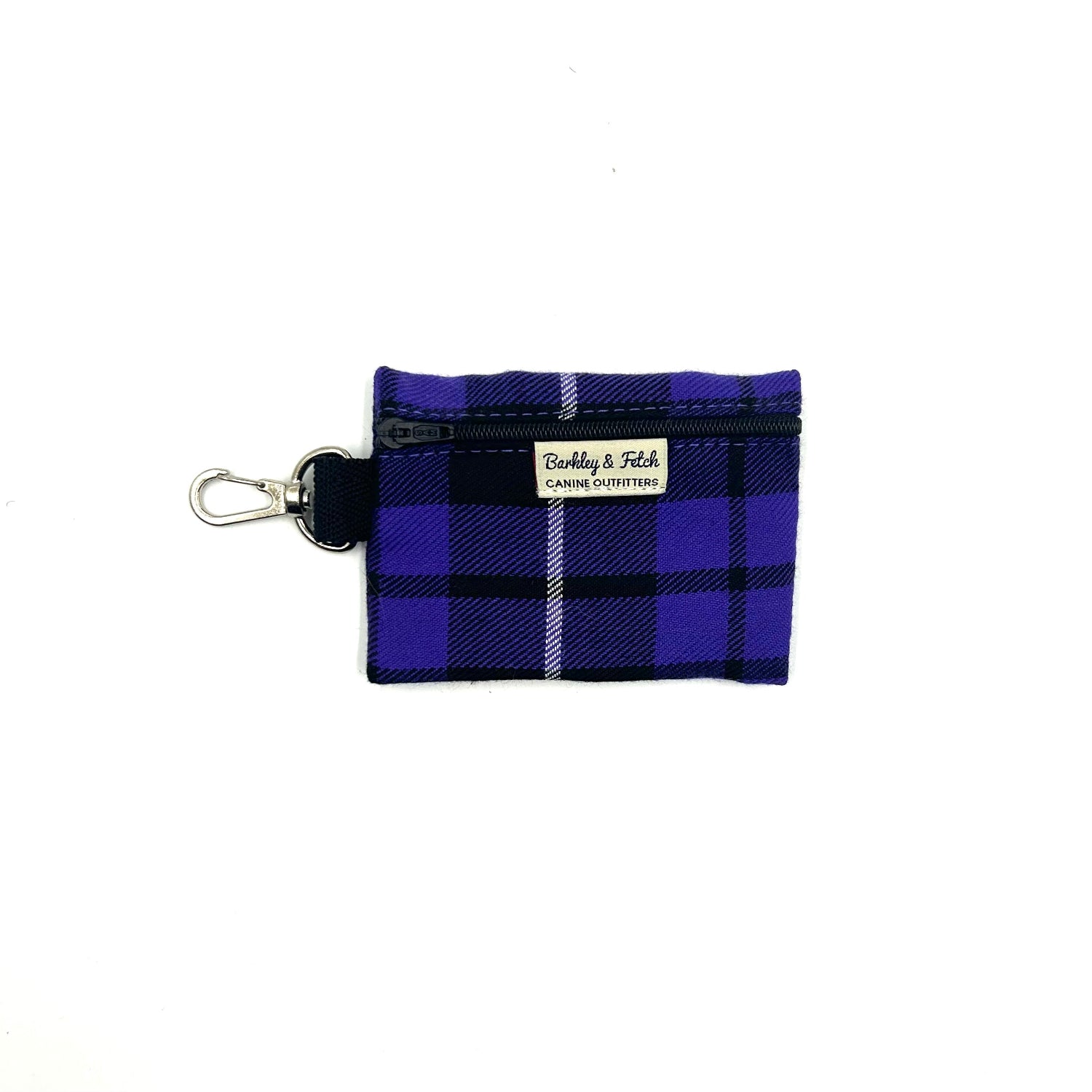 A purple tartan patterned poo bag holder with a clip attachment.