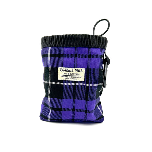 Purple plaid pet treat pouch with a visible brand label on a white background