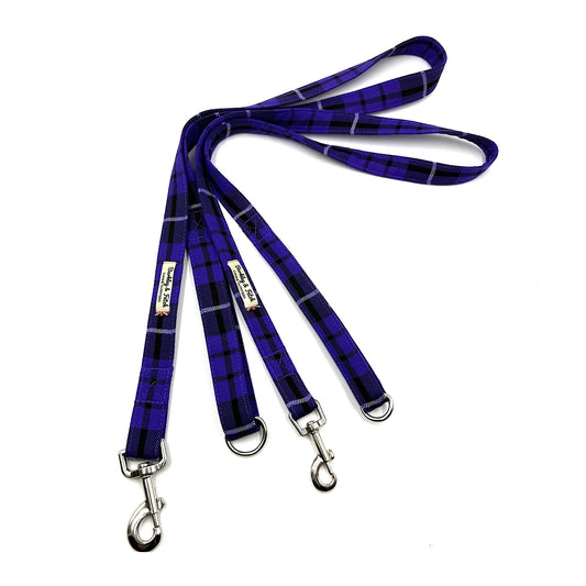 Purple plaid dog leash with metal clips on a white background