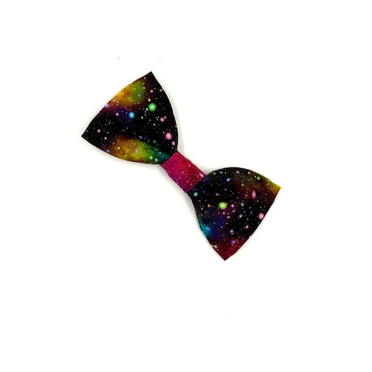 Colorful bow tie with a space-themed pattern on a white background
