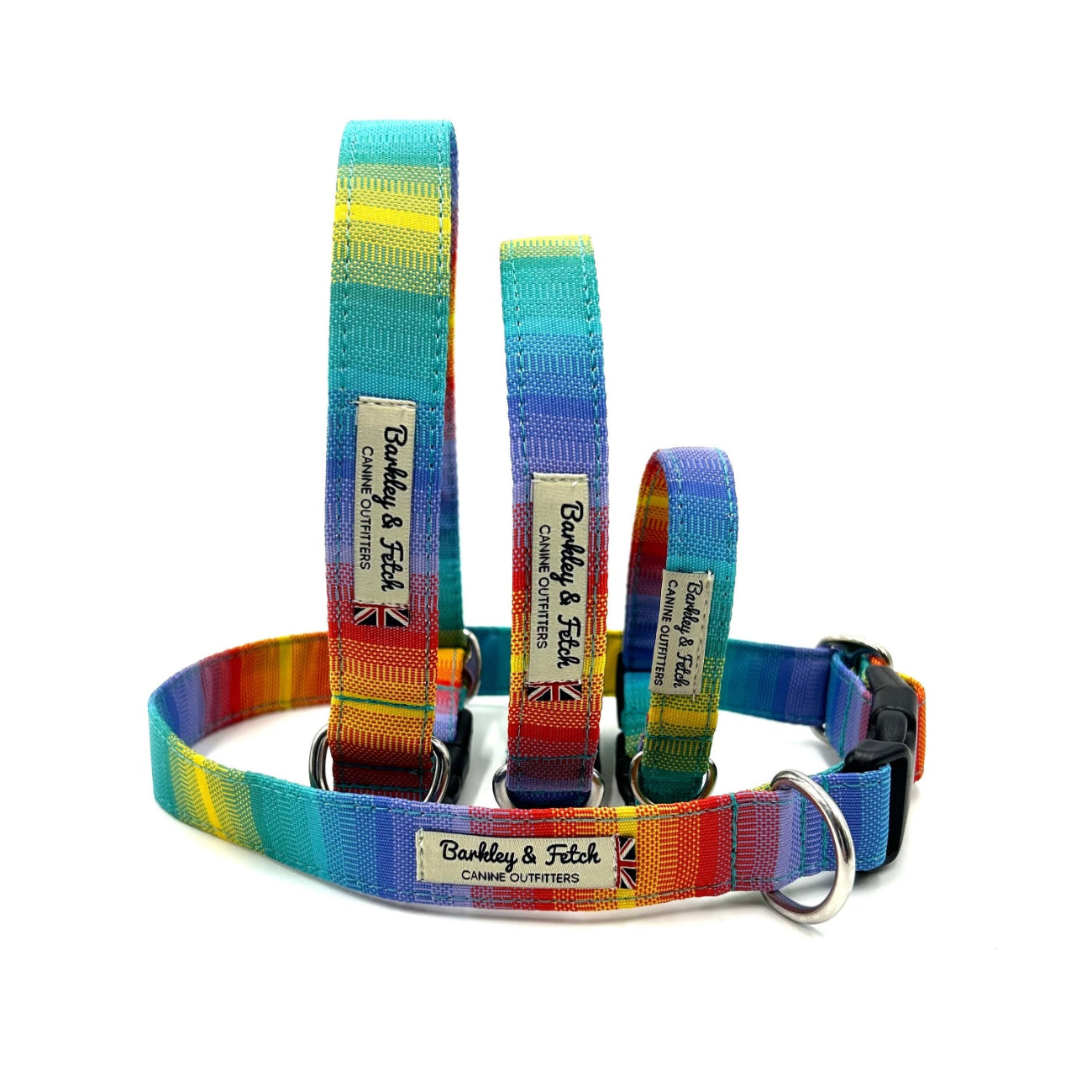Set of rainbow-colored dog collars and leashes with visible branding on a white background
