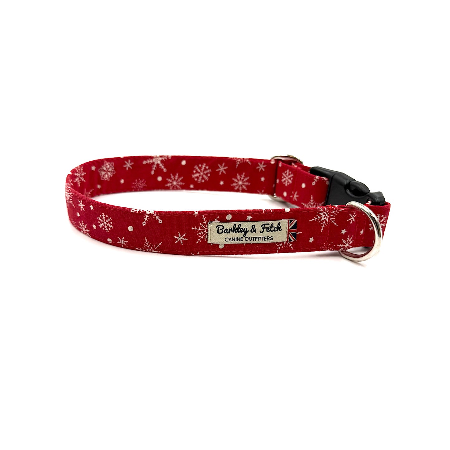 Red dog collar with white snowflake pattern on a white background handmade by barkley and fetch uk