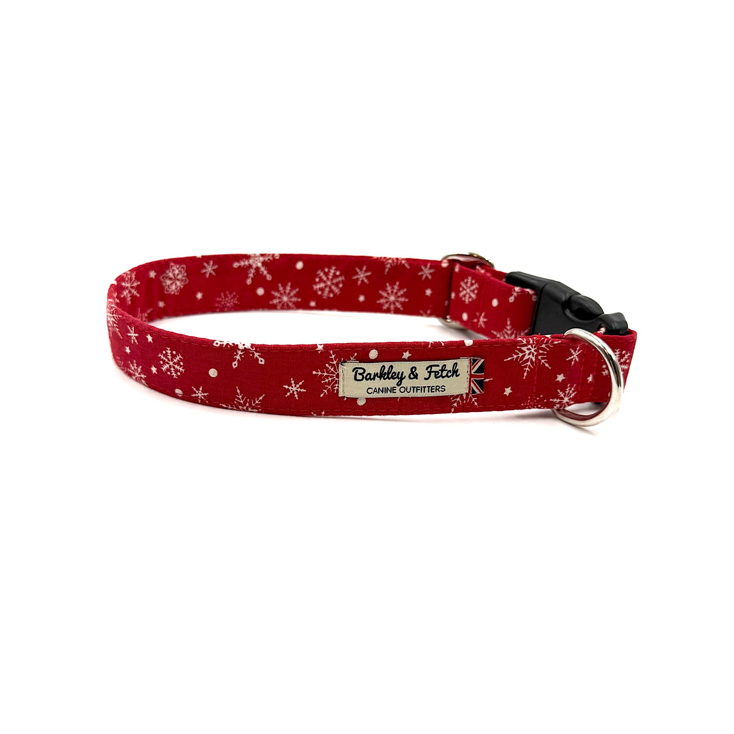 Red dog collar with white snowflake pattern on a white background handmade by barkley and fetch uk