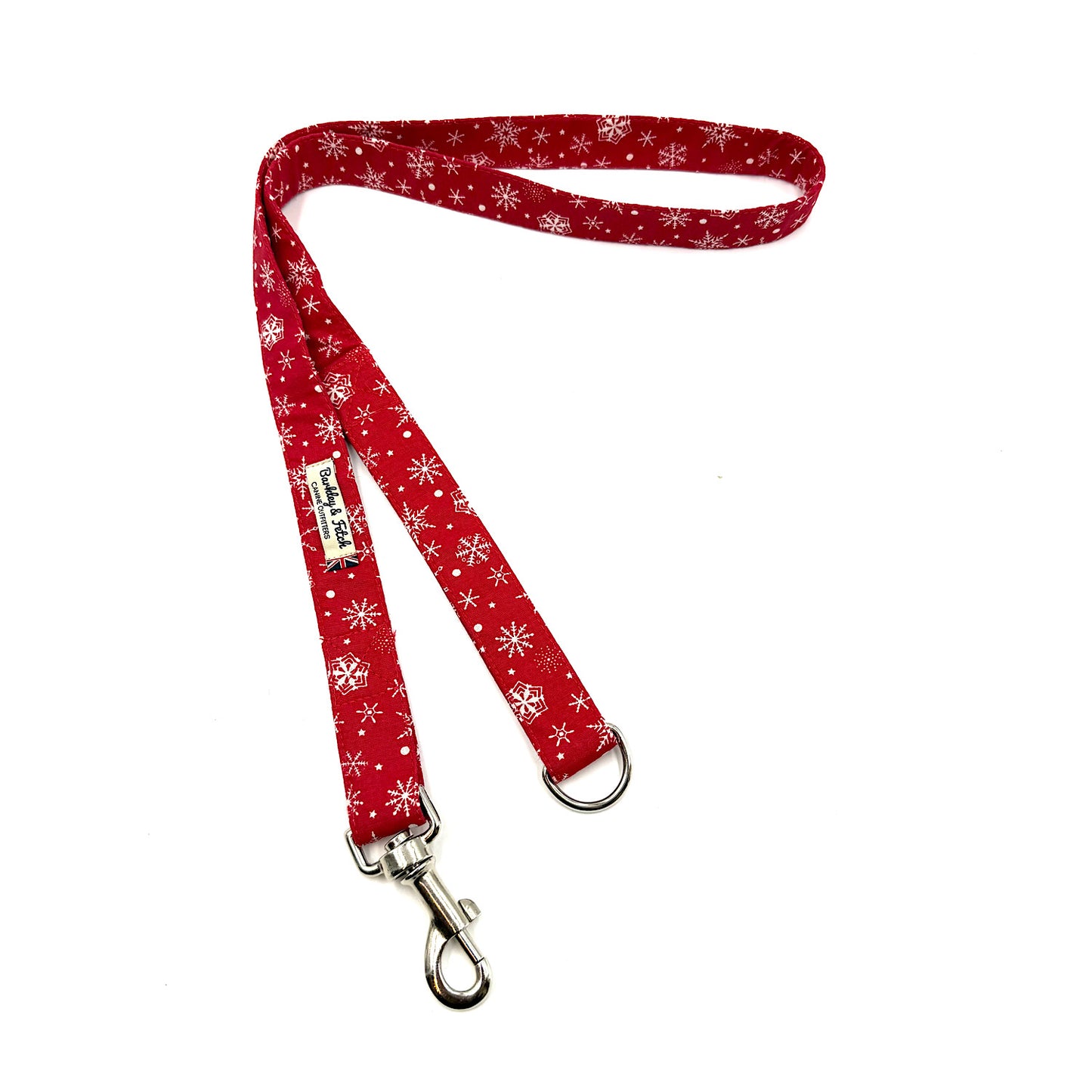Red dog leash with white snowflake pattern on a white background handmade by barkley and fetch uk