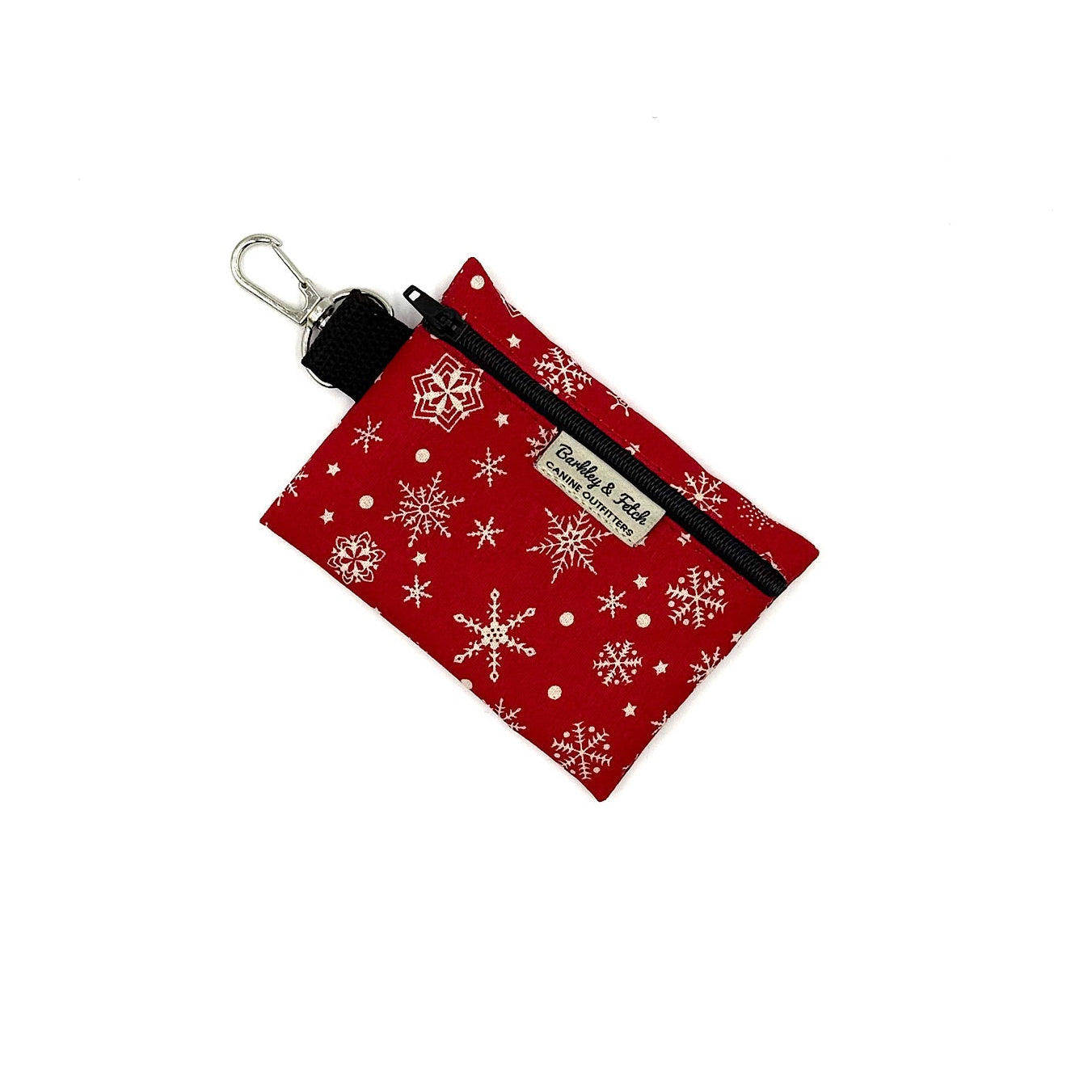 Red pouch with snowflake pattern and keychain clip on a white background