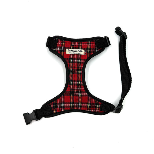 Red plaid dog harness with black straps on a white background Classic red tartan dog harness, handmade in the UK. Adjustable for the perfect fit with matching collar and lead available.