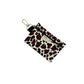 Leopard print pouch with keychain on a white background