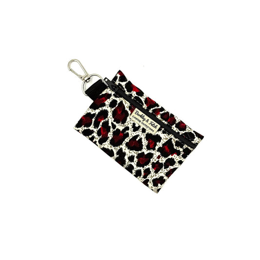 Leopard print pouch with keychain on a white background