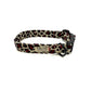 Dog collar with red and black pattern on a white background