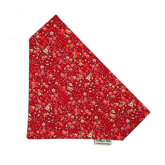 Red floral patterned dog bandana on a white background