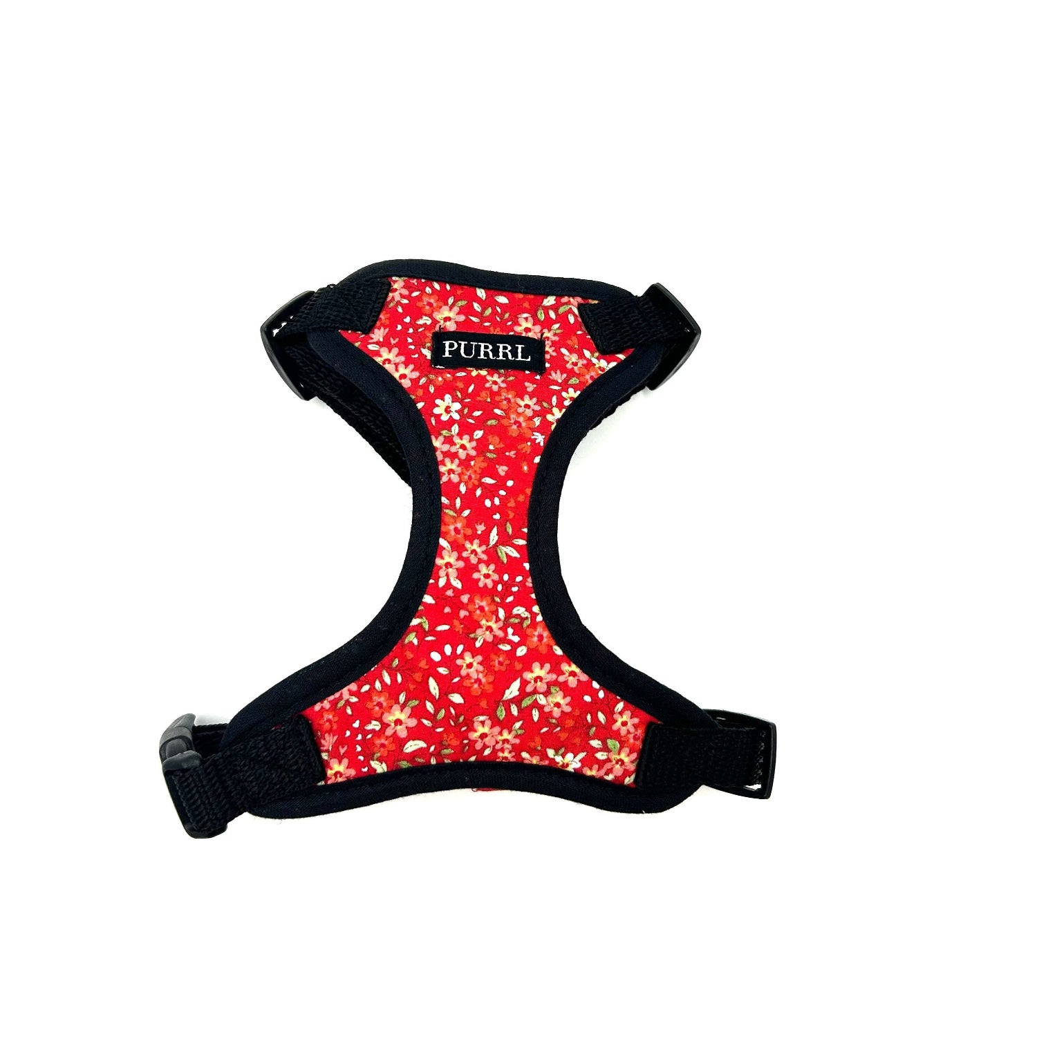 Red floral patterned cat  harness with black straps on a white background red ditsy floral purrl cat harness