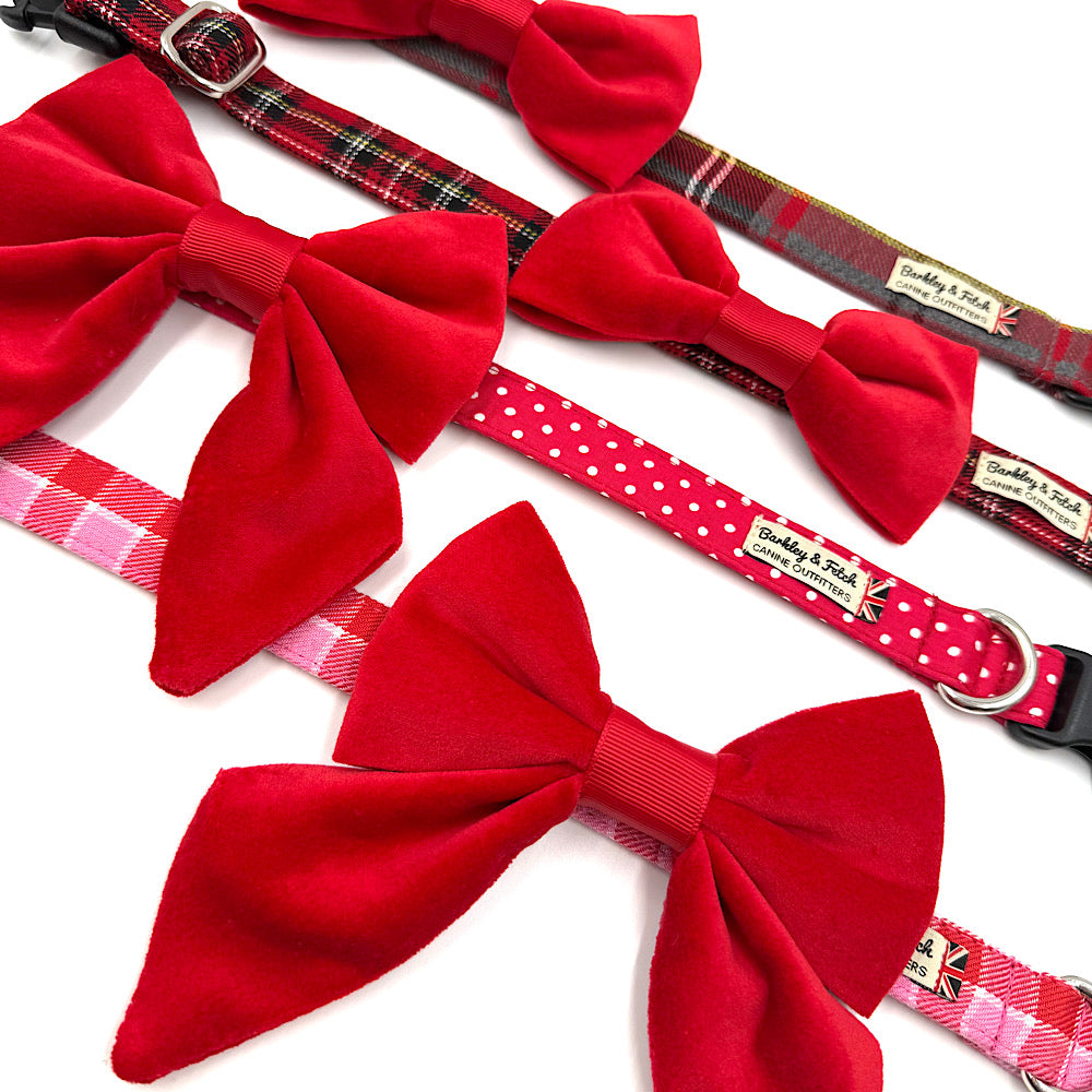 Dog collars with red bow ties and plaid patterns handmade by Barkley And Fetch on a white background