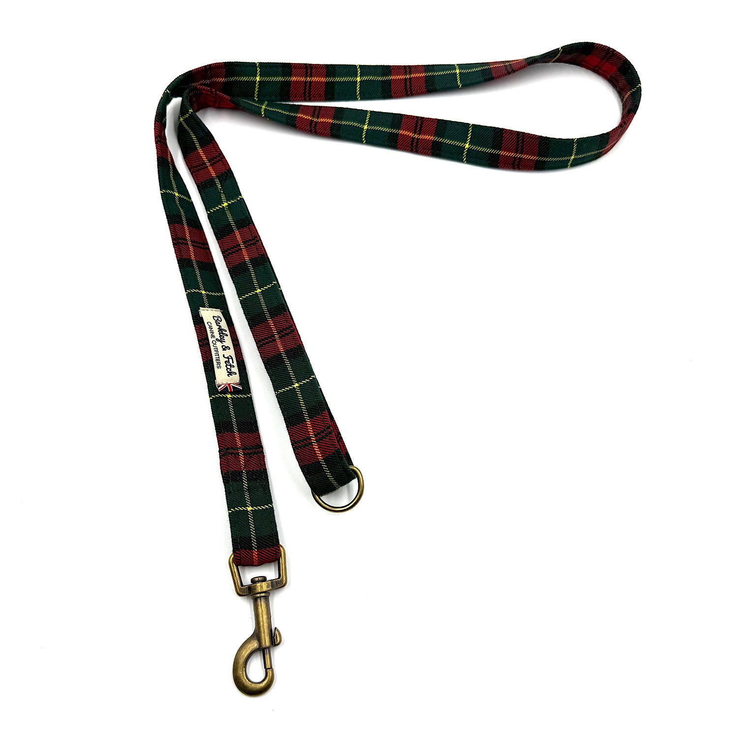 Plaid dog leash with brass clip on a white background