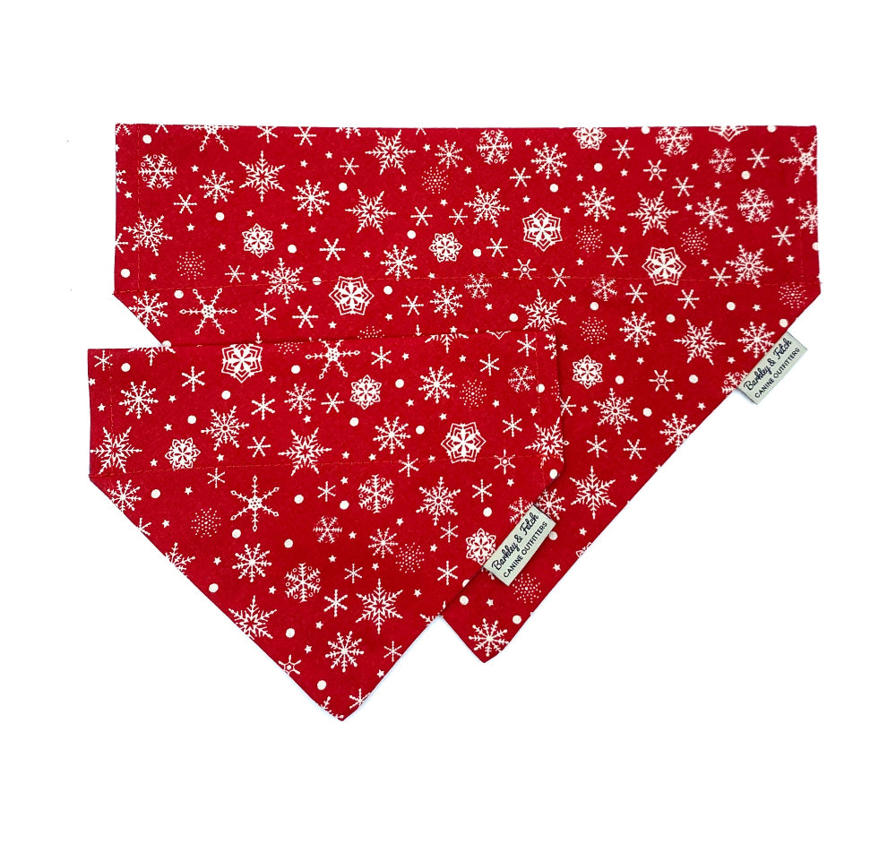Red bandana with white snowflake pattern on a white background handmade in uk by Barkley and Fetch