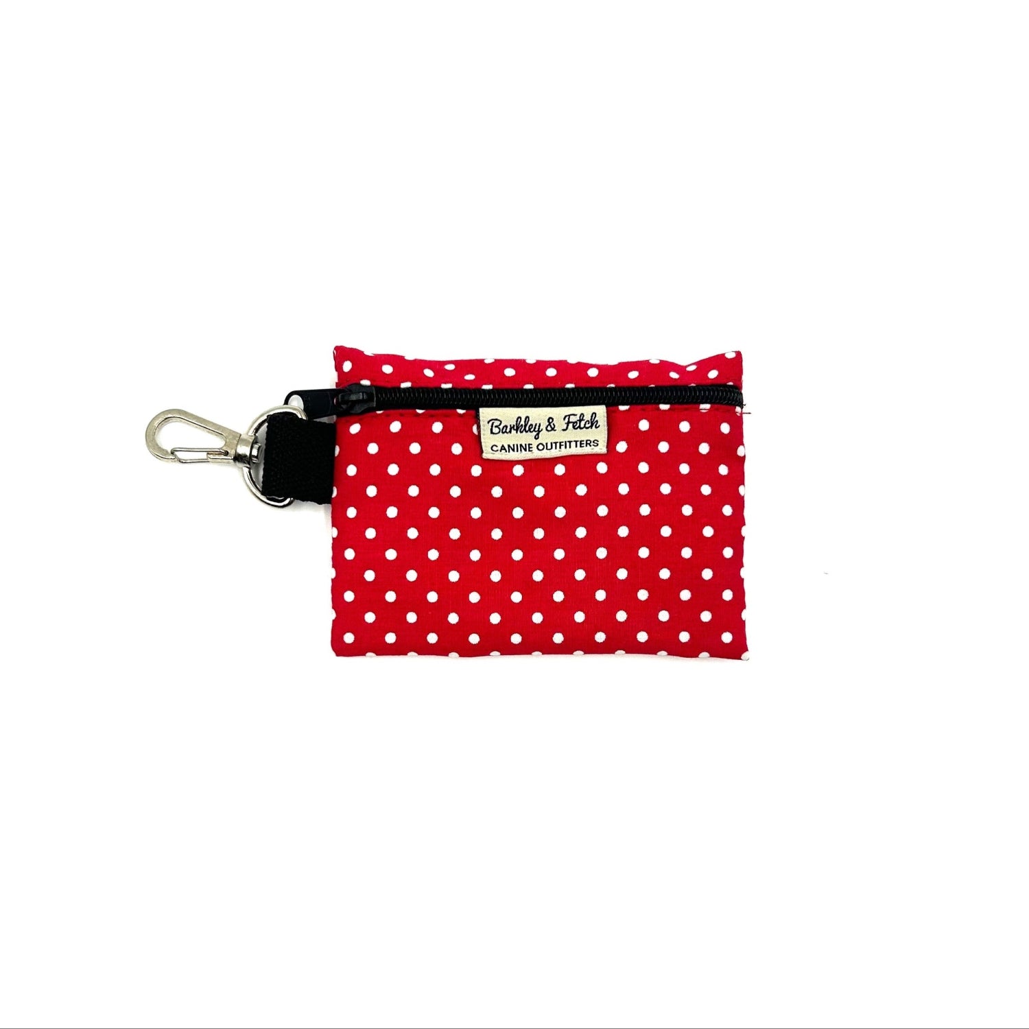 A red and white polka dot poo bag holder with a black clip and a brand label reading 'Barkley & Fetch