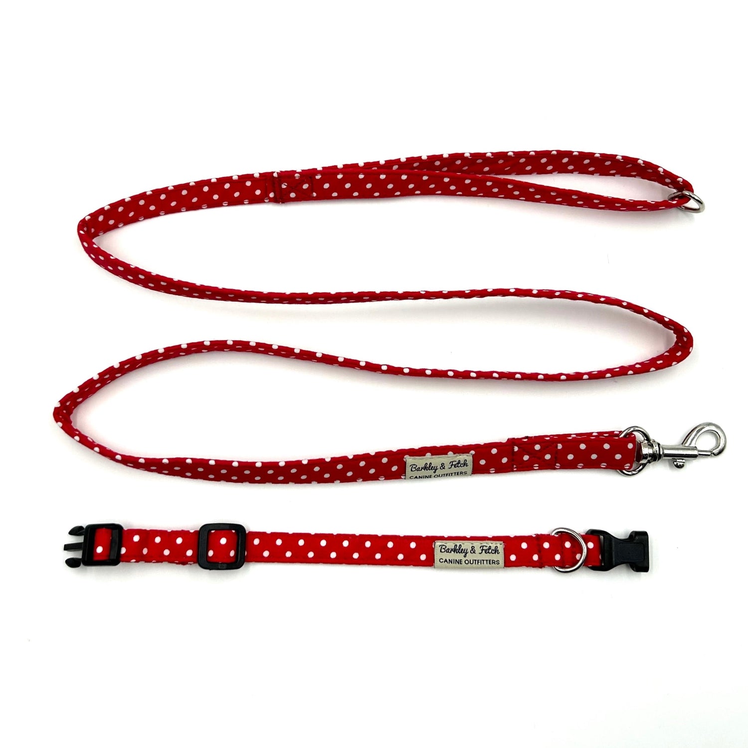 Red polka dot dog collar and leash set on a white background