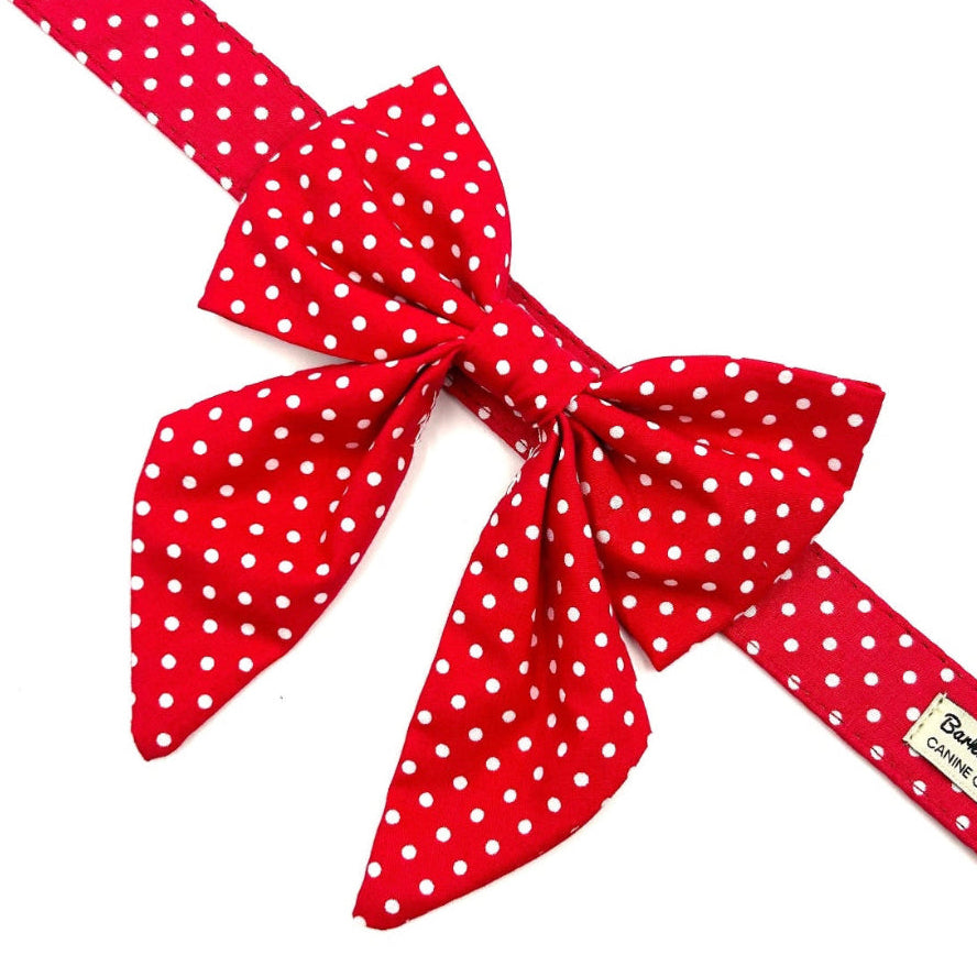 Red polka dot ribbon with a bow on a white background handmade in uk by barkley and fetch