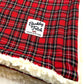 Red plaid blanket with a white label reading 'Barkley & Fetch' on a white background.
