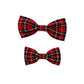 Two red plaid bow ties on a white background