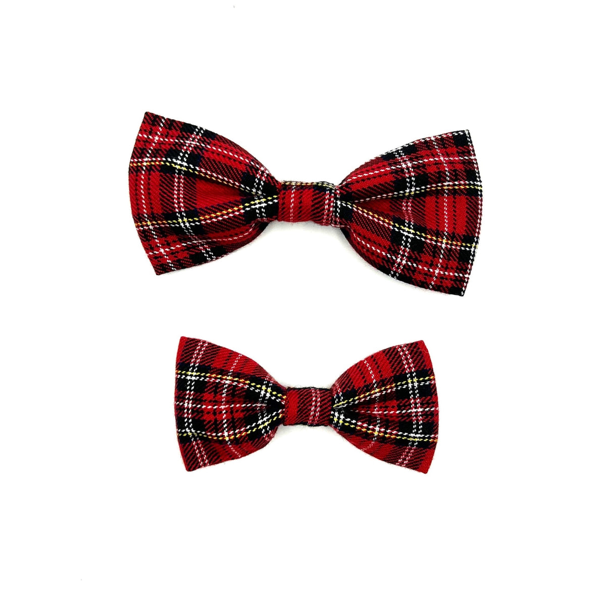 Two red plaid bow ties on a white background