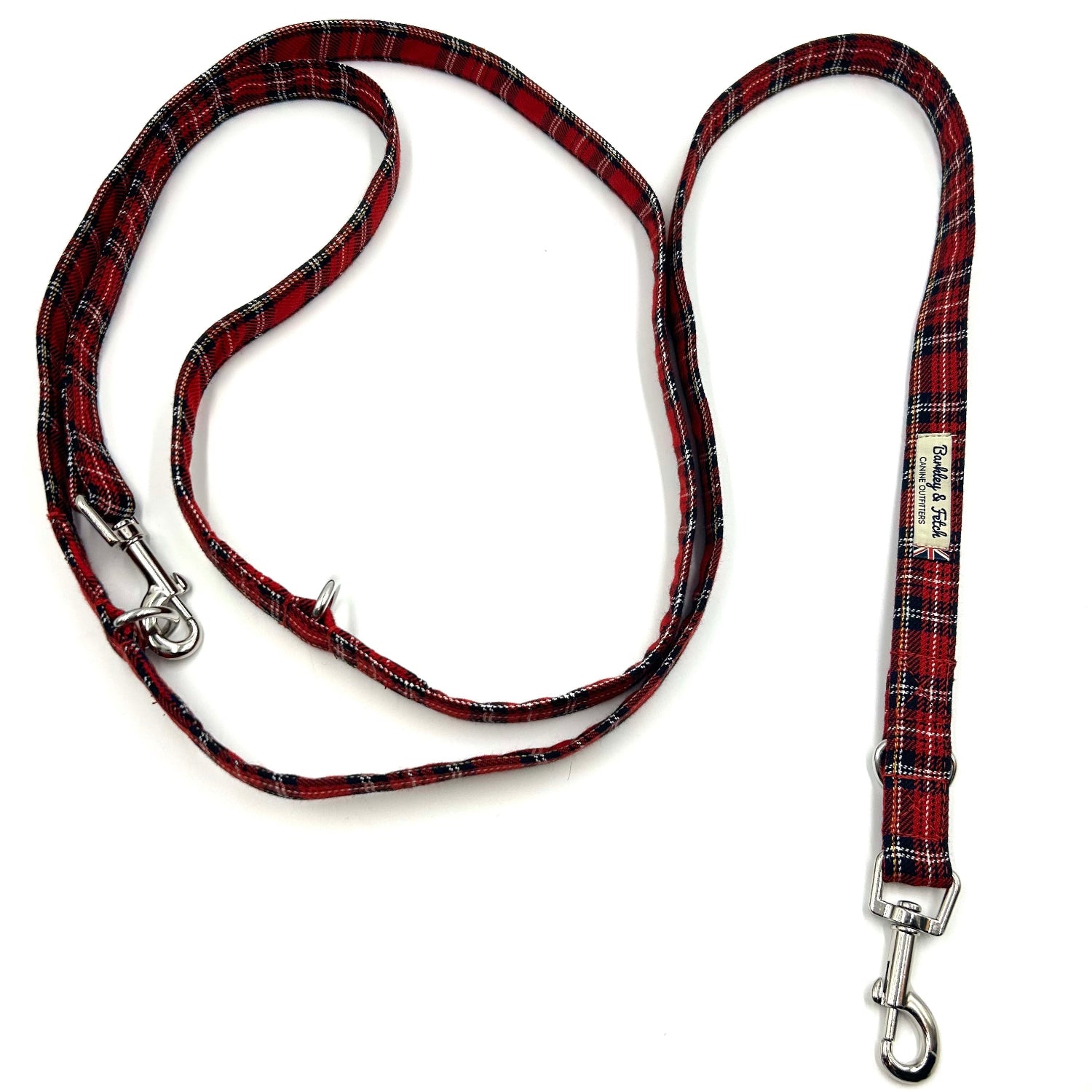 Red and black plaid dog leash with metal clasp on a white background