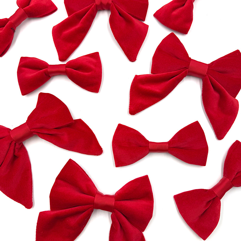 Multiple red bow ties arranged on a white background handmade by Barkley And Fetch
